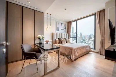 Luxurious modern bedroom with city view, elegant decor, and natural light.