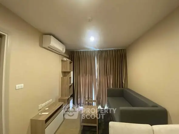 Modern living room with sleek furniture and air conditioning