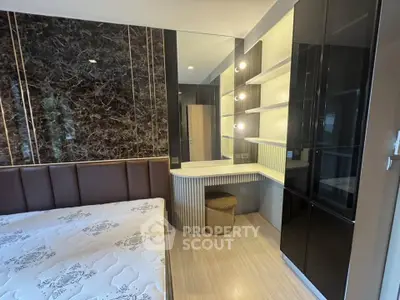 Luxurious bedroom with elegant decor and stylish built-in vanity in modern apartment.
