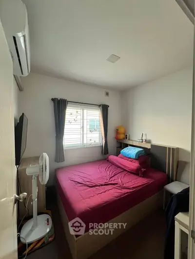 Cozy bedroom with modern air conditioning and natural light