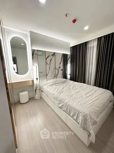Modern bedroom with stylish decor and elegant lighting