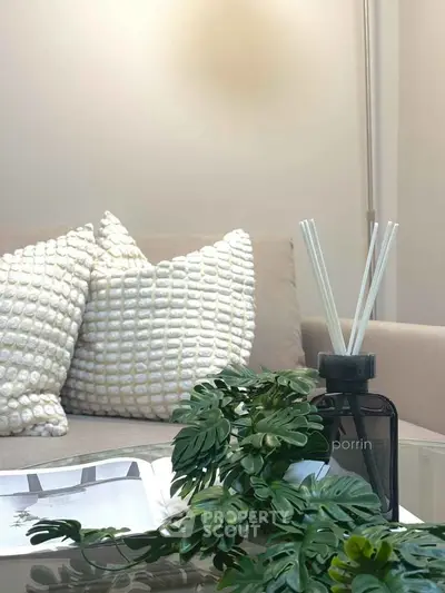 Stylish living room with cozy sofa and chic decor accents, perfect for modern living.