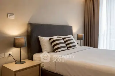 Elegant bedroom with modern decor and cozy lighting, perfect for relaxation and comfort.