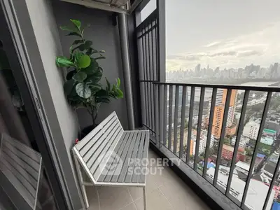 Chic urban balcony with stunning city skyline view, perfect for relaxation and enjoying the vibrant cityscape.