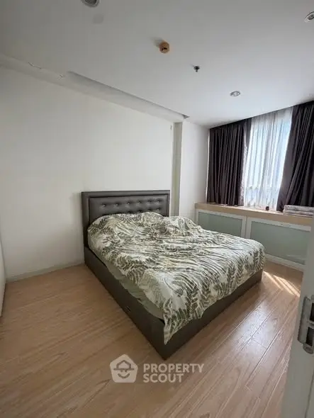 Cozy bedroom with modern decor and natural light