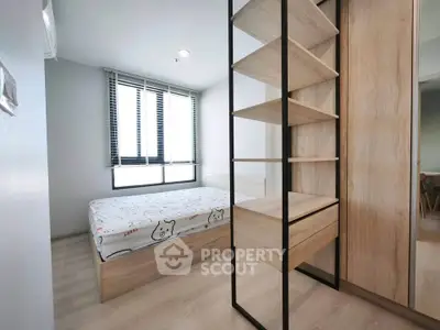 Modern minimalist bedroom with wooden furniture and large window