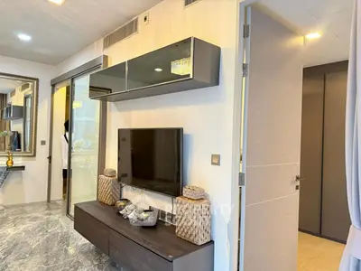 Modern living room with sleek TV unit and elegant decor