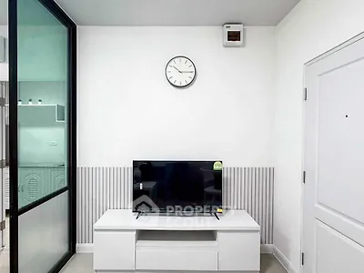 Modern living room with sleek TV setup and minimalist decor