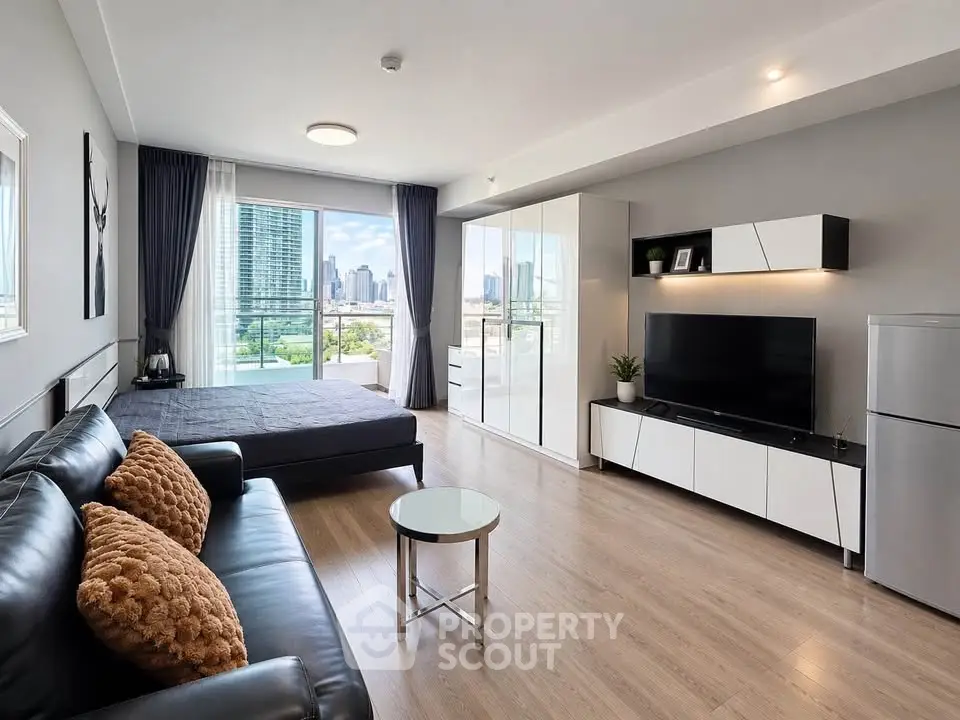 Modern studio apartment with sleek design and city view, featuring a cozy living area and stylish furnishings.