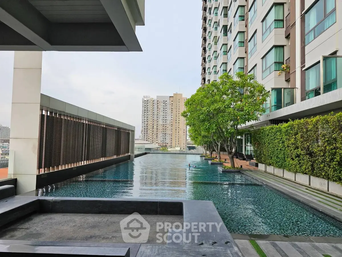 Luxurious condominium with stunning pool and modern architecture in urban setting