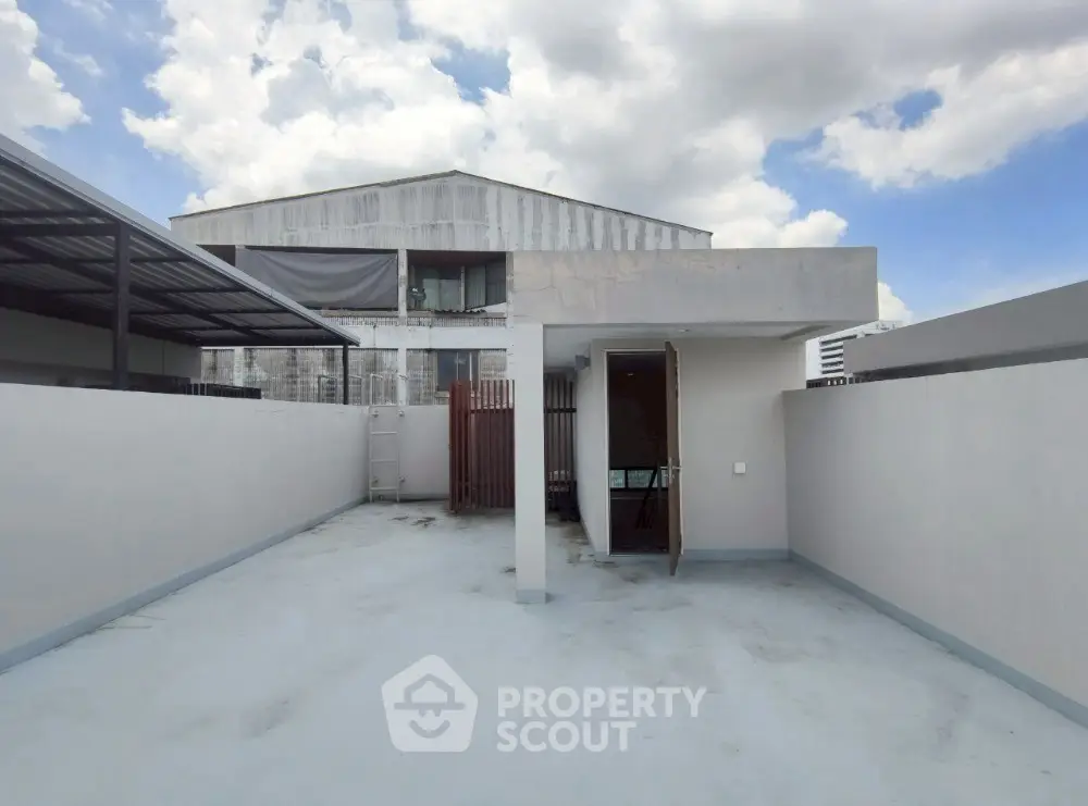 Spacious rooftop area with modern design and clear sky view