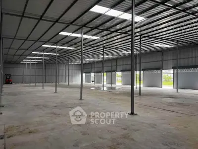 Spacious industrial warehouse with high ceilings and ample natural light