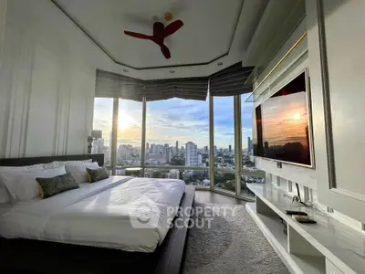 Luxurious bedroom with panoramic city views and modern decor