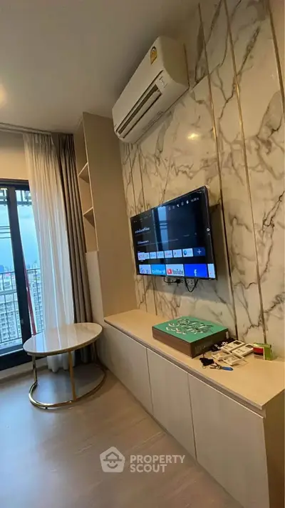 Modern living room with marble accent wall and city view balcony