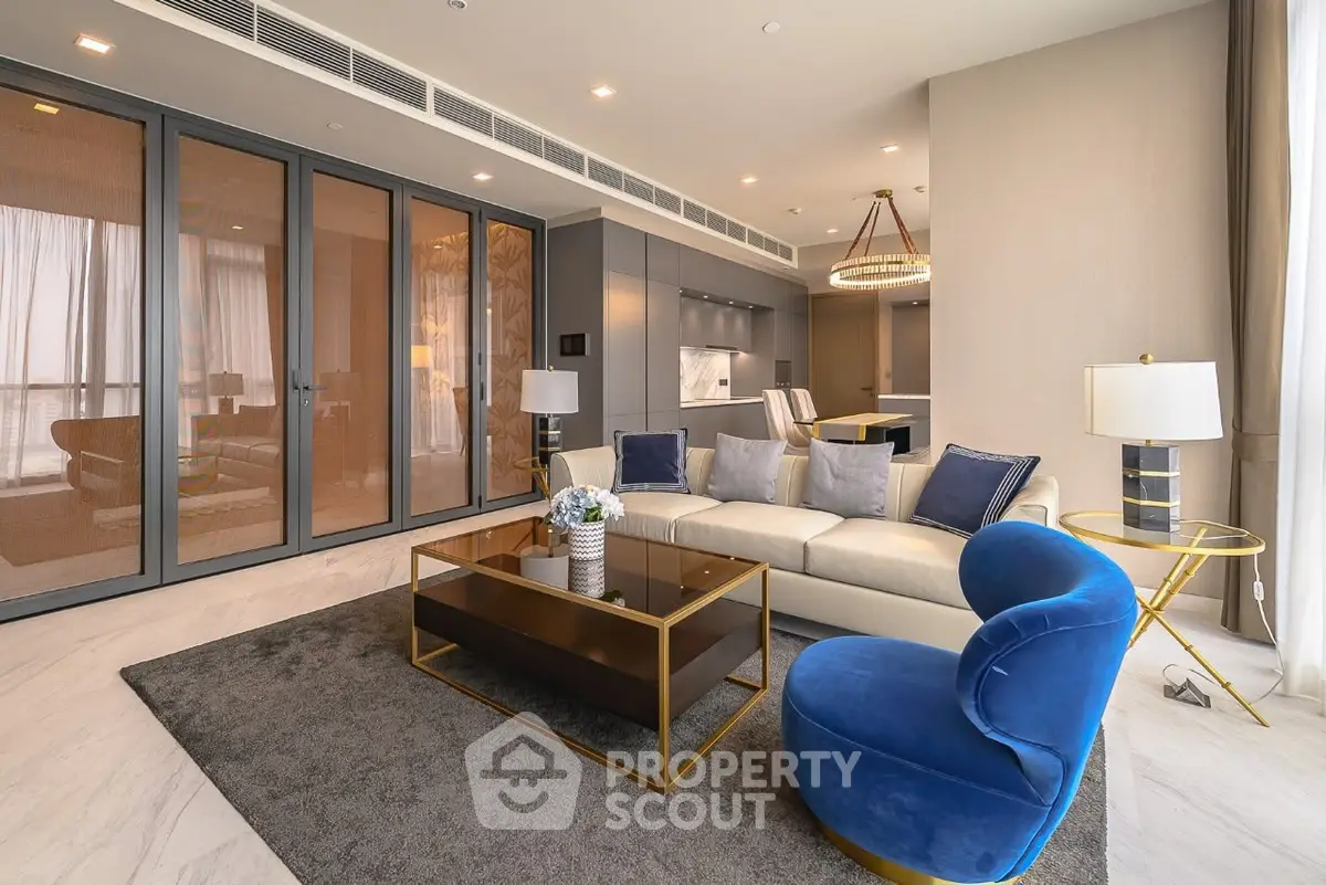 Luxurious modern living room with elegant furniture and open kitchen layout
