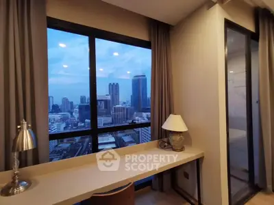 Stunning city view from modern study room with large windows and elegant decor.