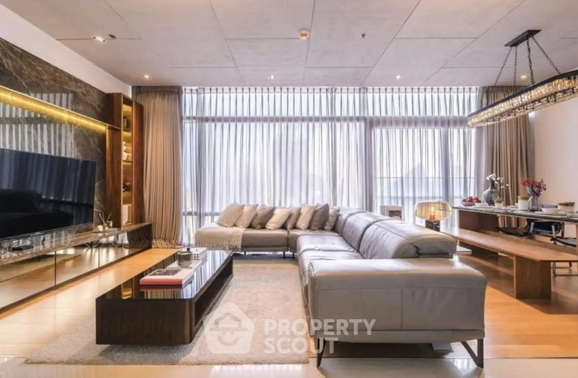 Luxurious modern living room with elegant decor and large windows