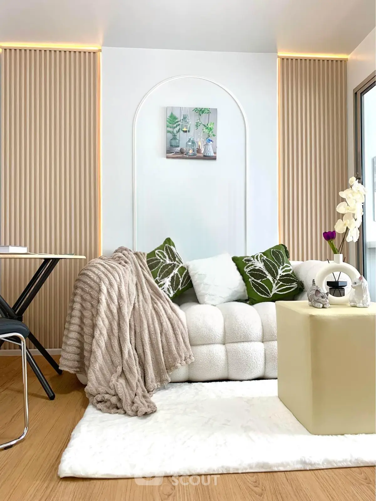 Modern living room with cozy sofa, elegant decor, and stylish lighting