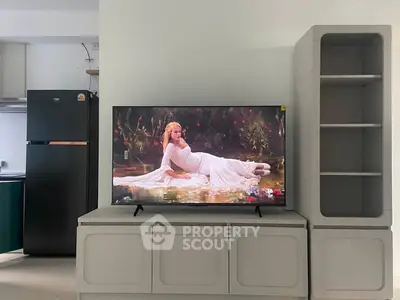 Modern living room with sleek TV setup and stylish shelving unit