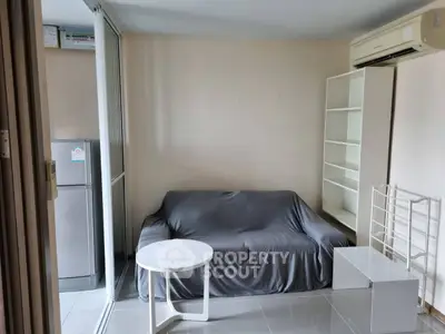 Cozy living room with air conditioning and modern furniture in a stylish apartment.