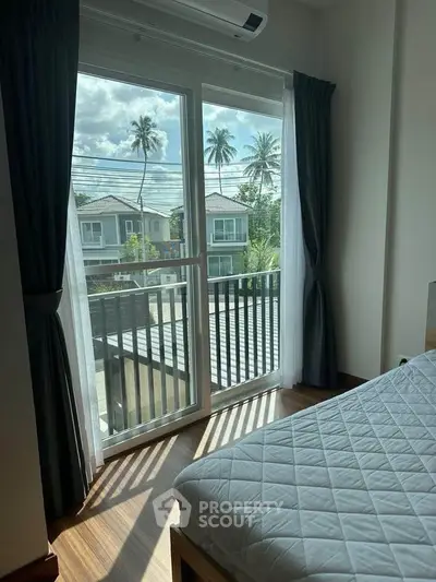 Bright bedroom with balcony view in modern home