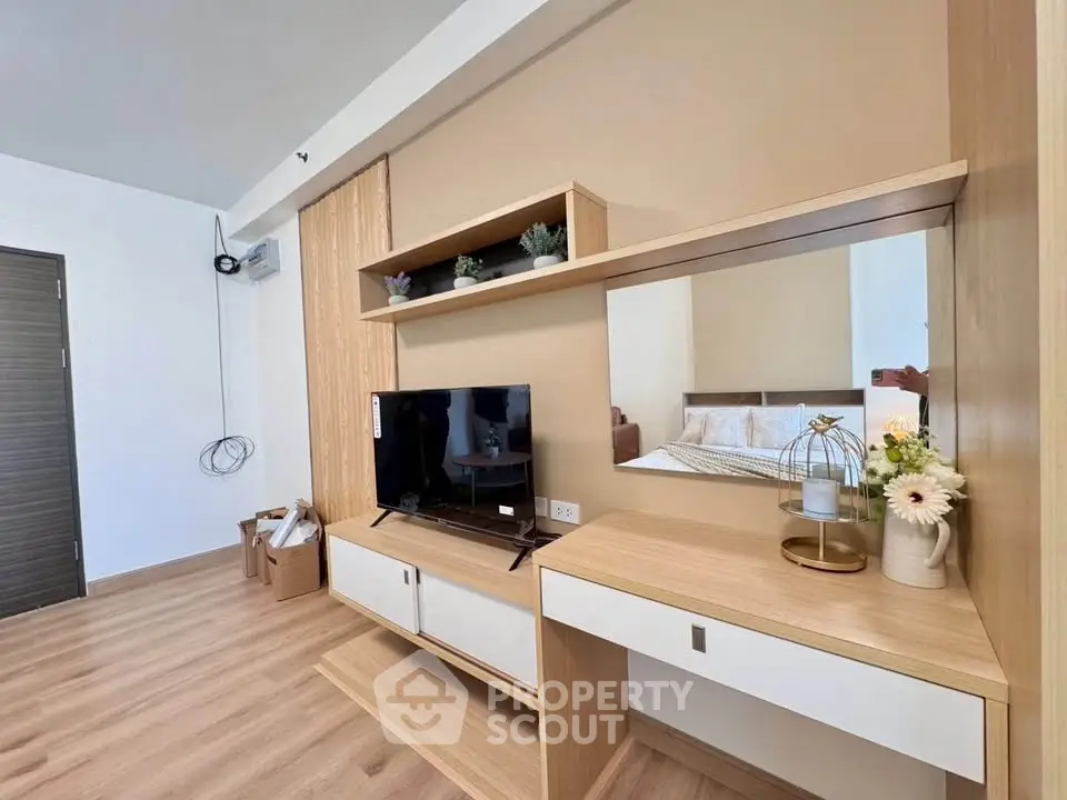 Modern living room with stylish wooden furniture and TV setup