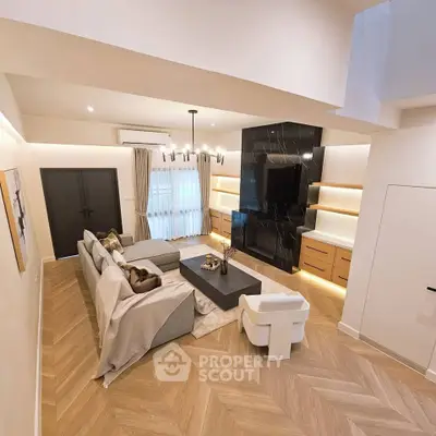 Luxurious modern living room with elegant decor and spacious layout, featuring a stylish sectional sofa and chic lighting.