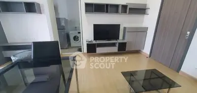 Modern living room with sleek furniture and integrated washing machine.