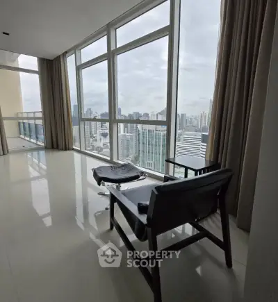 Luxurious high-rise apartment with stunning city view and modern interior design.