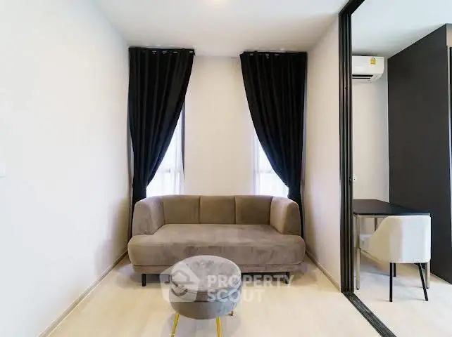 Modern living room with stylish sofa and elegant curtains in a cozy apartment.