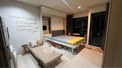 Modern studio apartment with stylish decor and cozy ambiance, featuring a comfortable bed and chic furnishings.