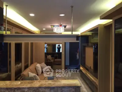 Luxurious modern living room with elegant lighting and plush seating, perfect for relaxation and entertainment.