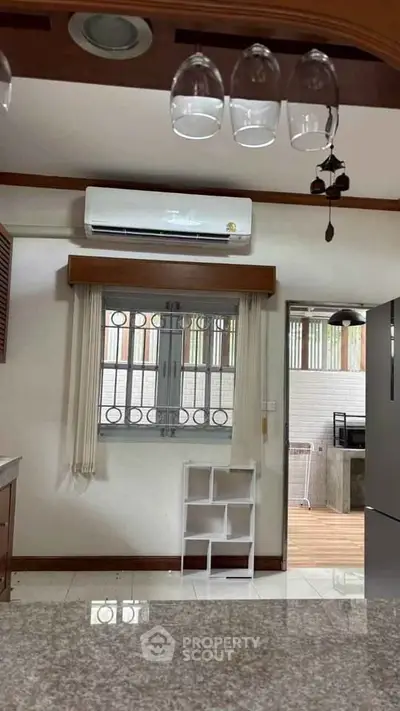 Modern kitchen with air conditioning and sleek countertop