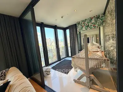 Chic balcony with hammock and city view, perfect for relaxation.