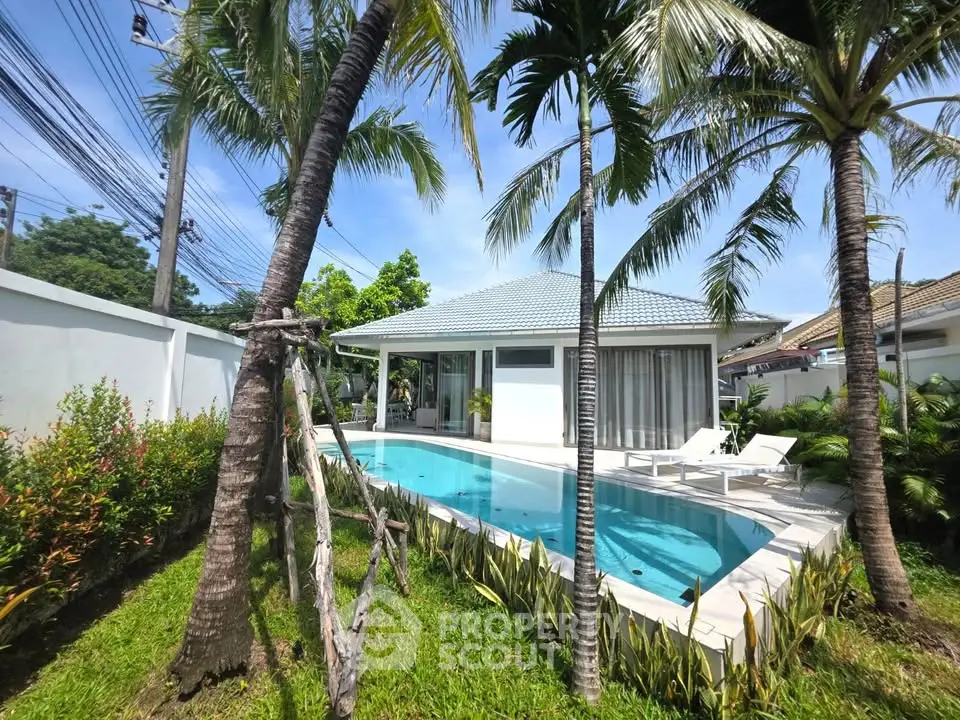Luxurious villa with private pool and lush garden, perfect for tropical living.