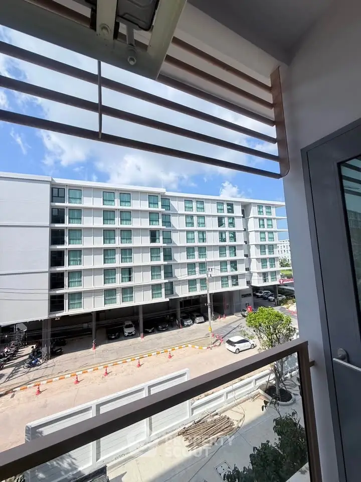 Modern apartment building view from balcony with clear blue sky