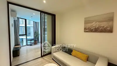Modern living room with sliding glass doors and cozy sofa