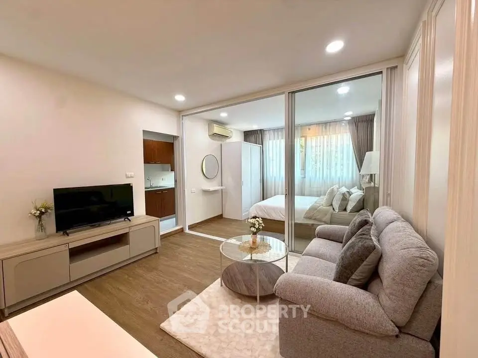 Modern open-plan living room with cozy sofa and stylish decor