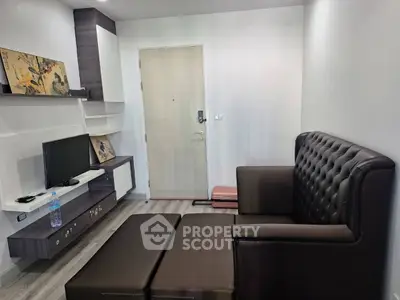 Modern living room with stylish furniture and entertainment center