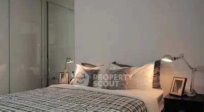 Modern bedroom with stylish decor and cozy lighting