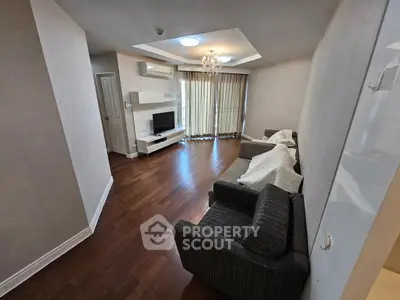 Spacious living room with hardwood floors and modern decor