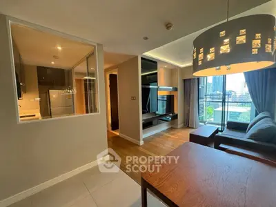 Modern living room with city view, stylish lighting, and open layout