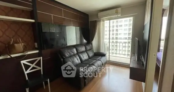 Modern living room with balcony view in high-rise apartment