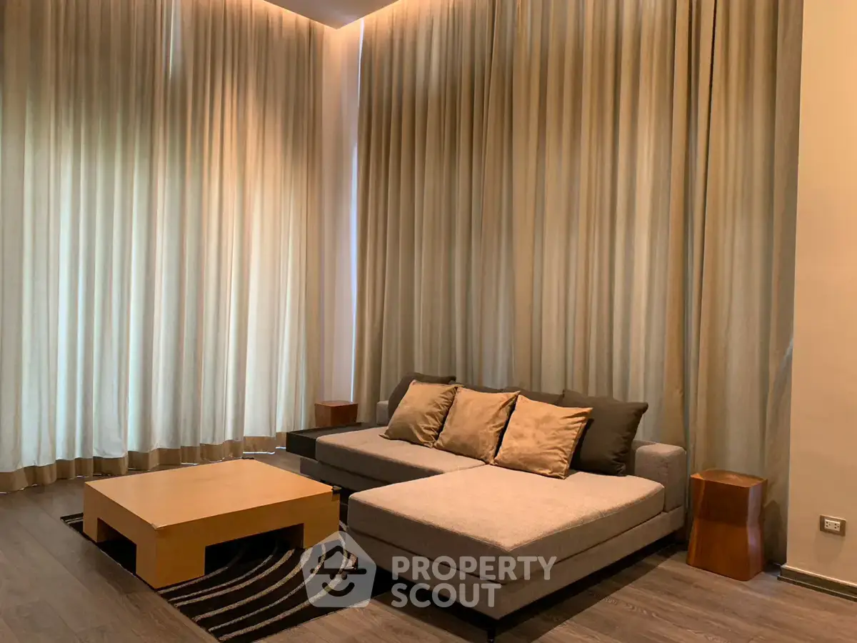 Luxurious living room with elegant curtains and modern furniture