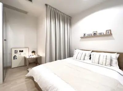 Cozy minimalist bedroom with soft lighting and elegant decor