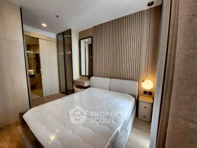 Modern bedroom with stylish decor and cozy lighting