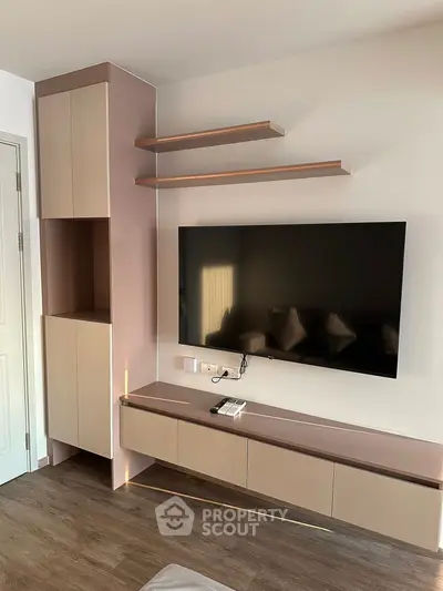 Modern living room with sleek TV unit and stylish shelving