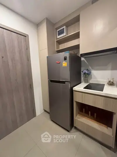 Modern kitchen with sleek fridge and minimalist design