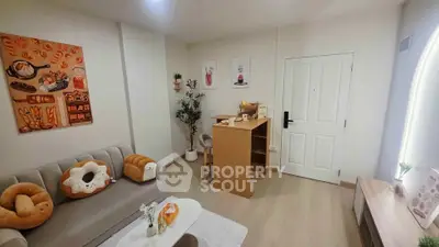 Charming living room with cozy decor and modern furnishings, perfect for relaxation and entertaining.