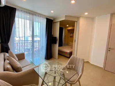 Modern living room with glass table and city view balcony